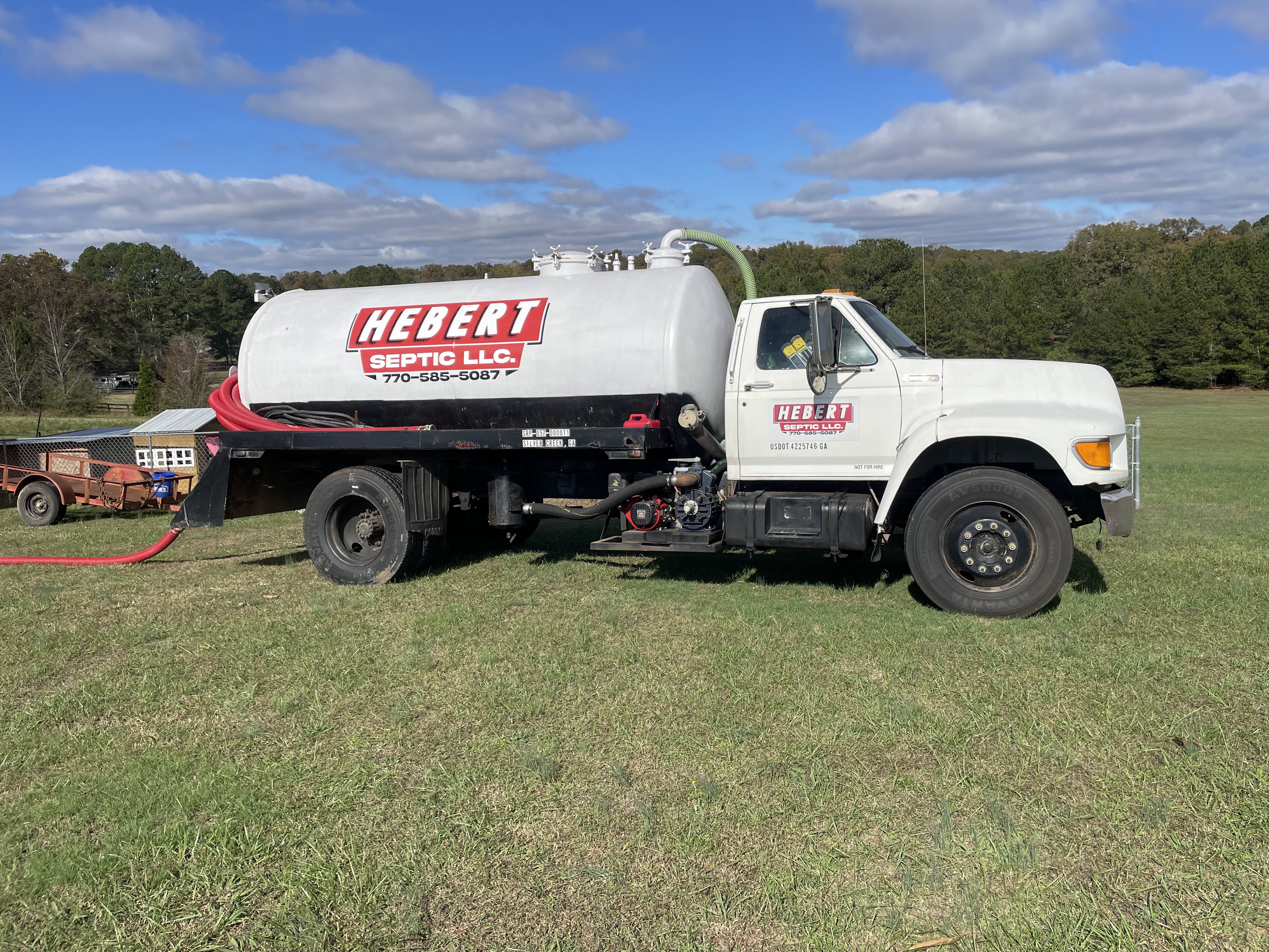 Hebert Septic truck at a customer's property